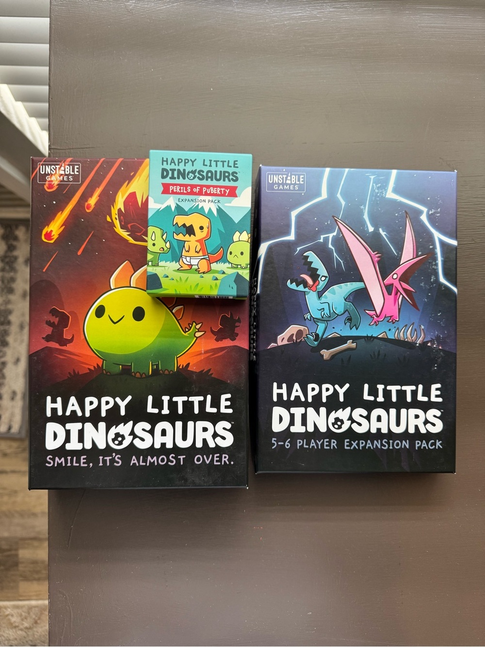 Happy Little Dinosaurs Board Game with Expansion Packs
